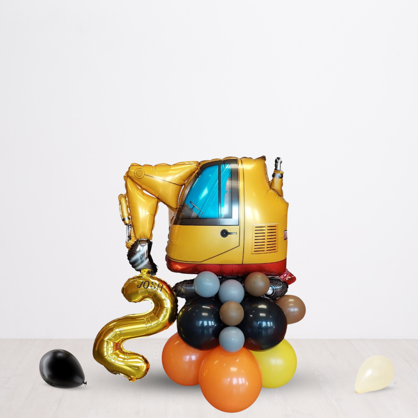 Black and yellow digger balloon sculpture bouquet