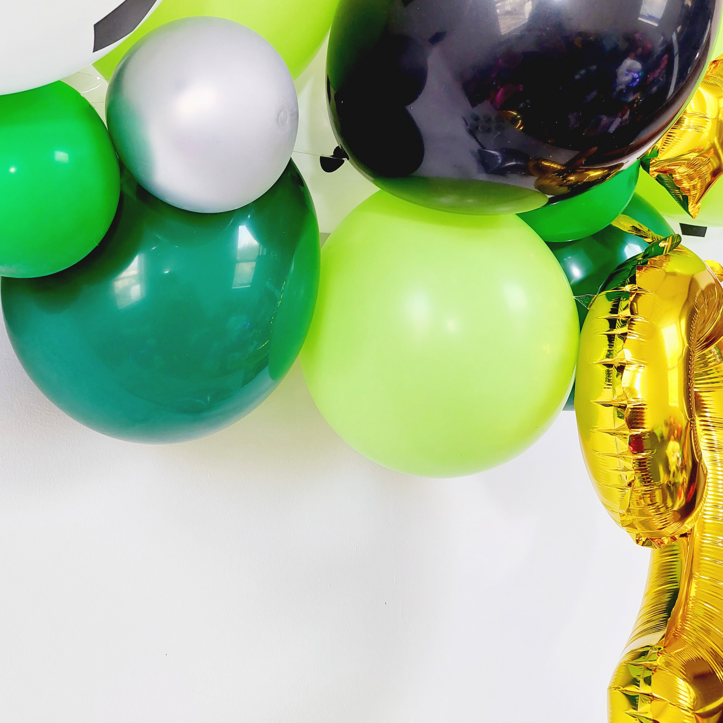 Black and Green Football balloon garland with 16inch golden number